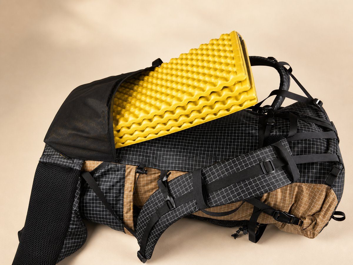Side profile of the 3F UL Gear Qidian Pro showing the frameless back panel seam and the hipbelt attachment.