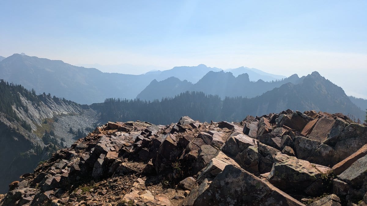 Wildfire smoke hazing the peaks around Snoqualmie Pass, seen from Red Mountain in September.